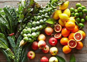 a group of fruits and vegetables on a wood surface Healthy Weight Loss Diets Wiltshire