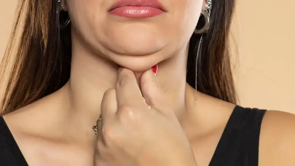 An image of a woman with double chin, sad, worried : Non Surgical Double Chin Removal Treatment in Wiltshire, UK